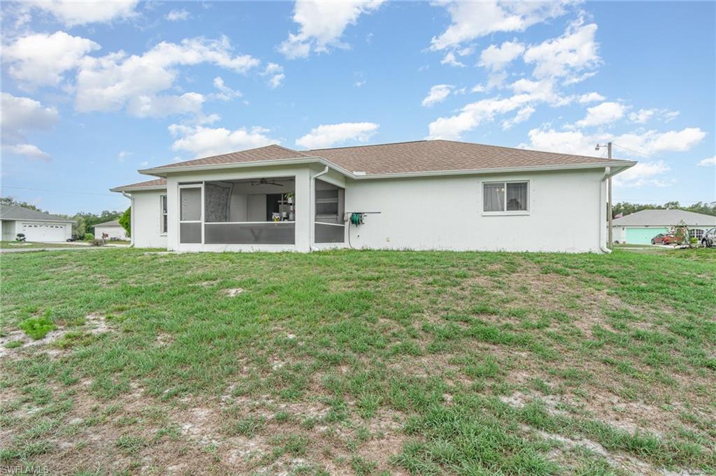 879 Rue Labeau Circle Fort Myers, FL 33913 - Photo 27 of 27 a front view of a house with a garden