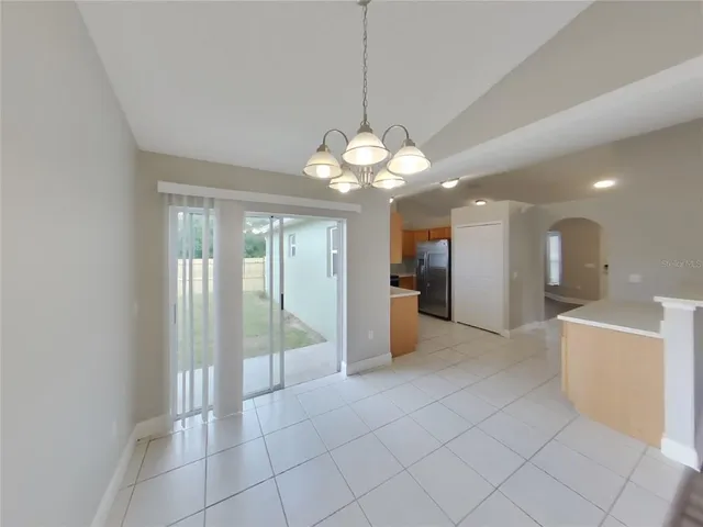 a view of a kitchen and a chandelier