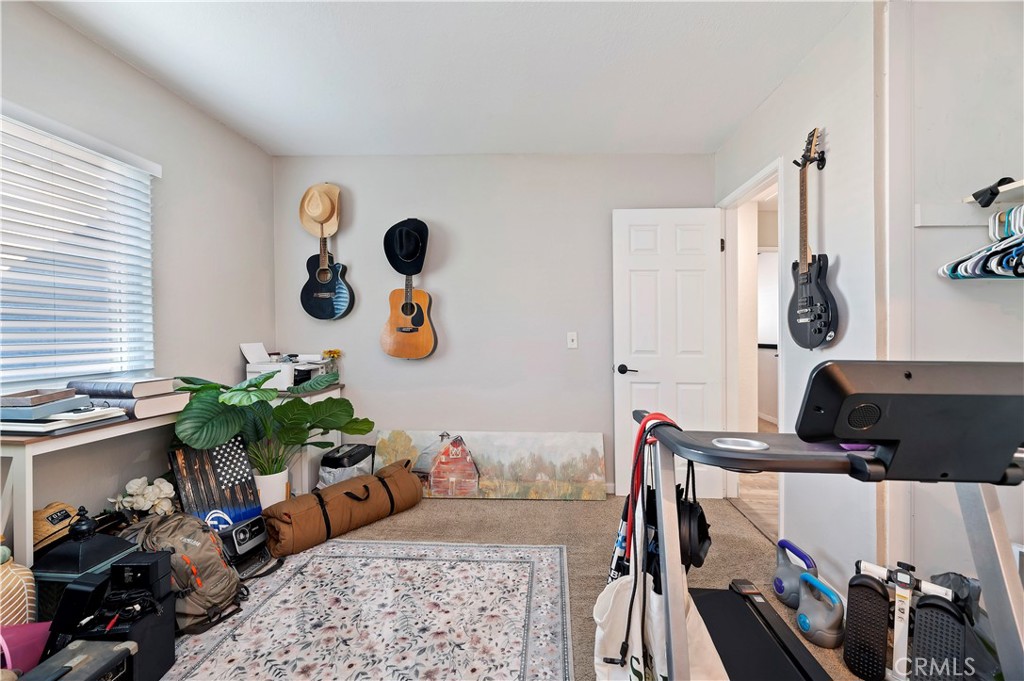 25143 Sugar Hill Road Moreno Valley, CA 92553 - Photo 23 of 28 a living room with furniture and a window