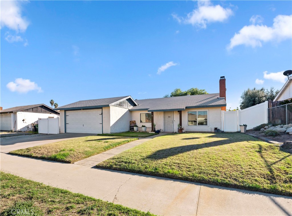 25143 Sugar Hill Road Moreno Valley, CA 92553 - Photo 5 of 28 a view of a house with a swimming pool and sitting area
