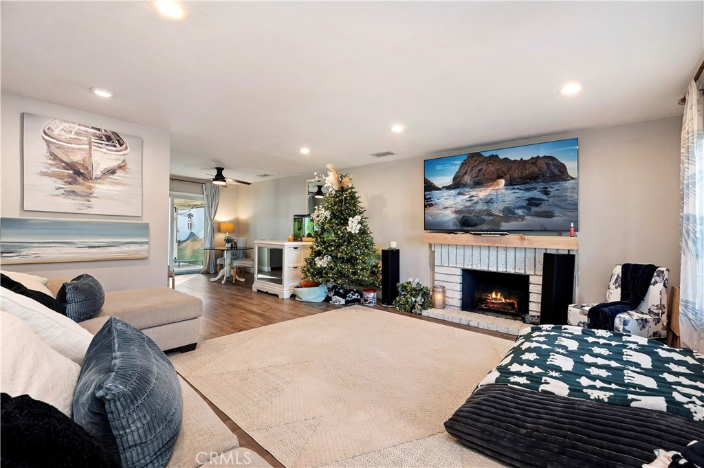 25143 Sugar Hill Road Moreno Valley, CA 92553 - Photo 7 of 28 a living room with furniture and a fireplace