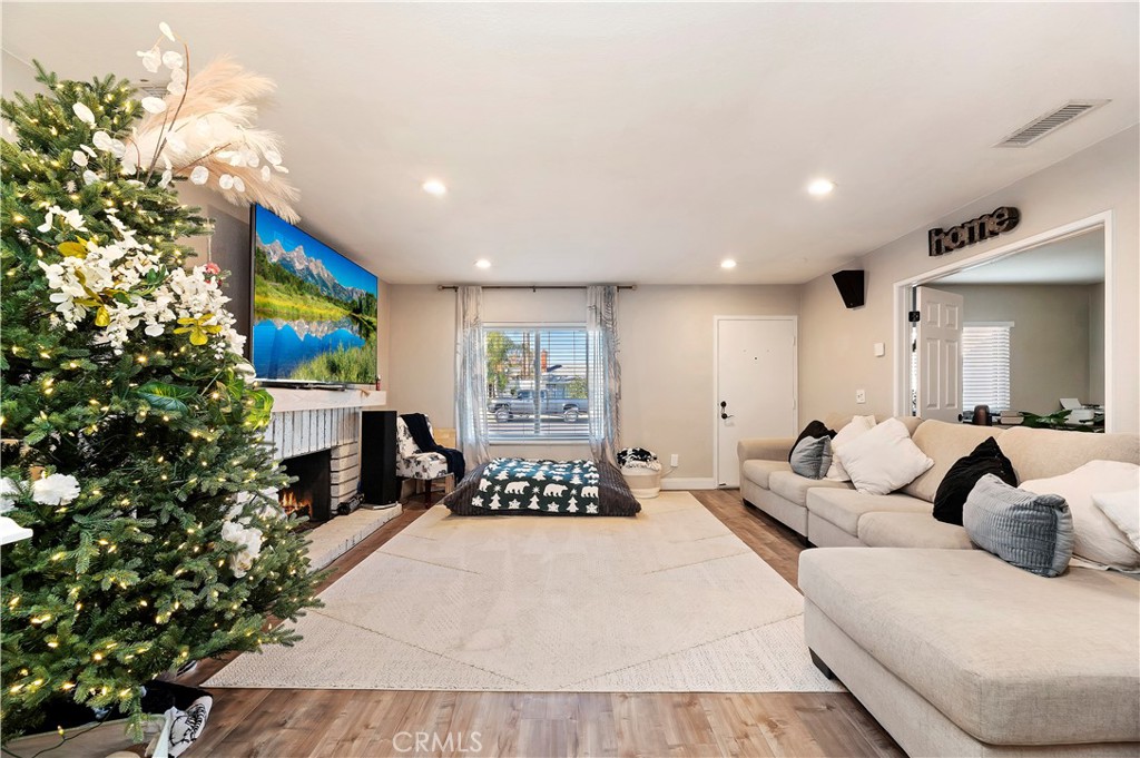 25143 Sugar Hill Road Moreno Valley, CA 92553 - Photo 9 of 28 a bedroom with a bed and a couch