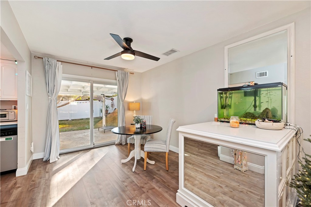 25143 Sugar Hill Road Moreno Valley, CA 92553 - Photo 10 of 28 a room that has a table and chairs in it