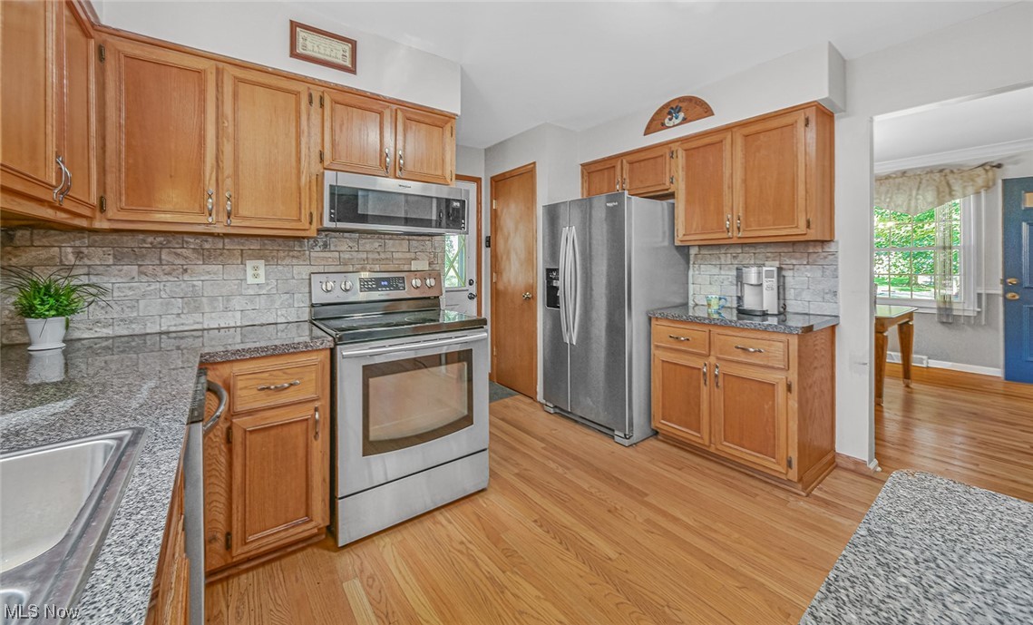 446 Stratford Road Akron, OH 44333 - Photo 11 of 29 Kitchen with stainless steel appliances, and hardwood floors.