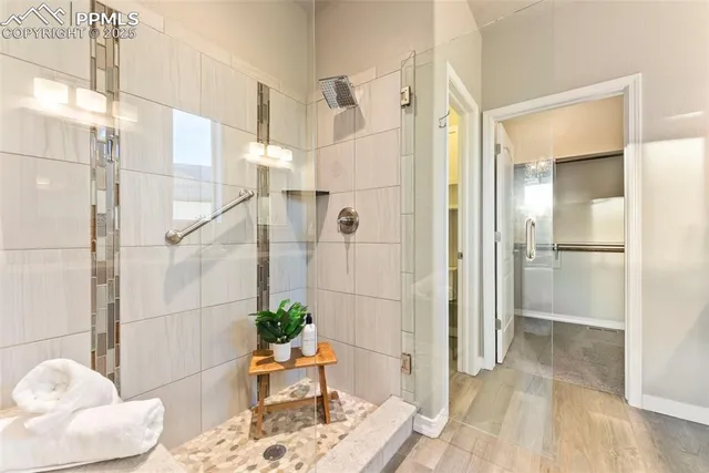 a view of a dining room with furniture and a chandelier