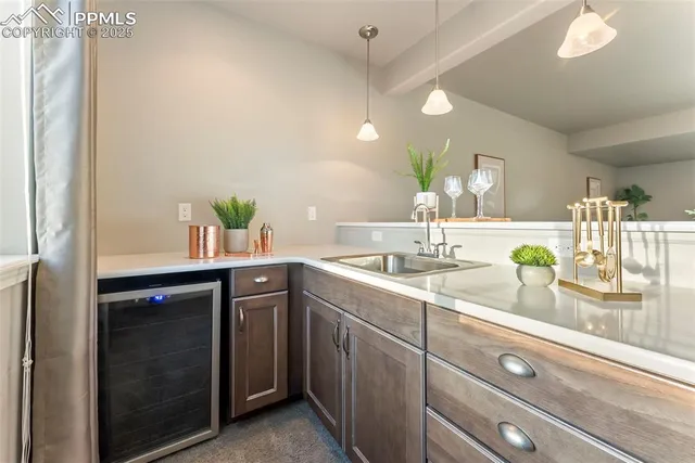 an aerial view of residential houses with city view