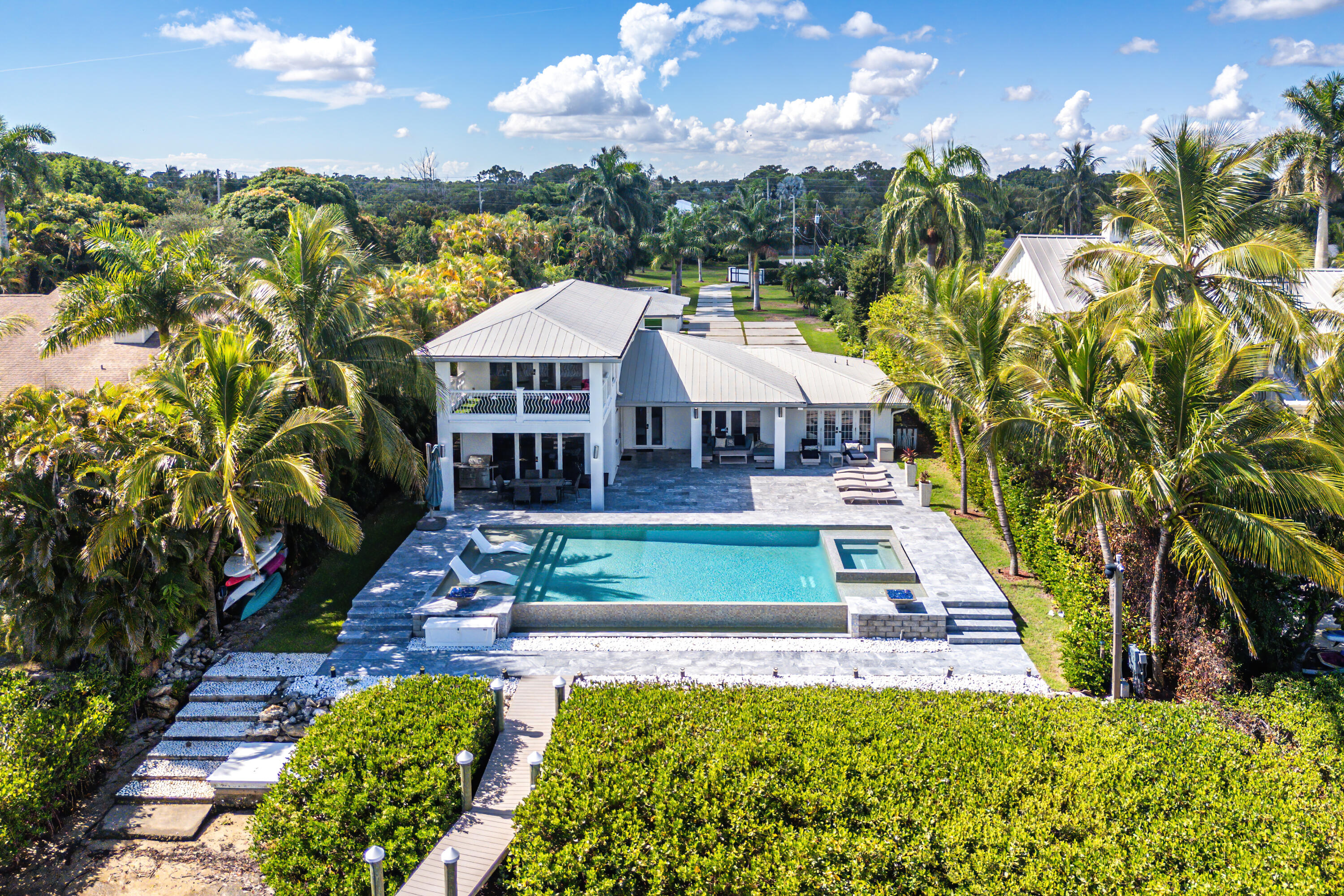 5447 Center Street Jupiter, FL 33458 - Photo 51 of 60 a view of a house with a yard