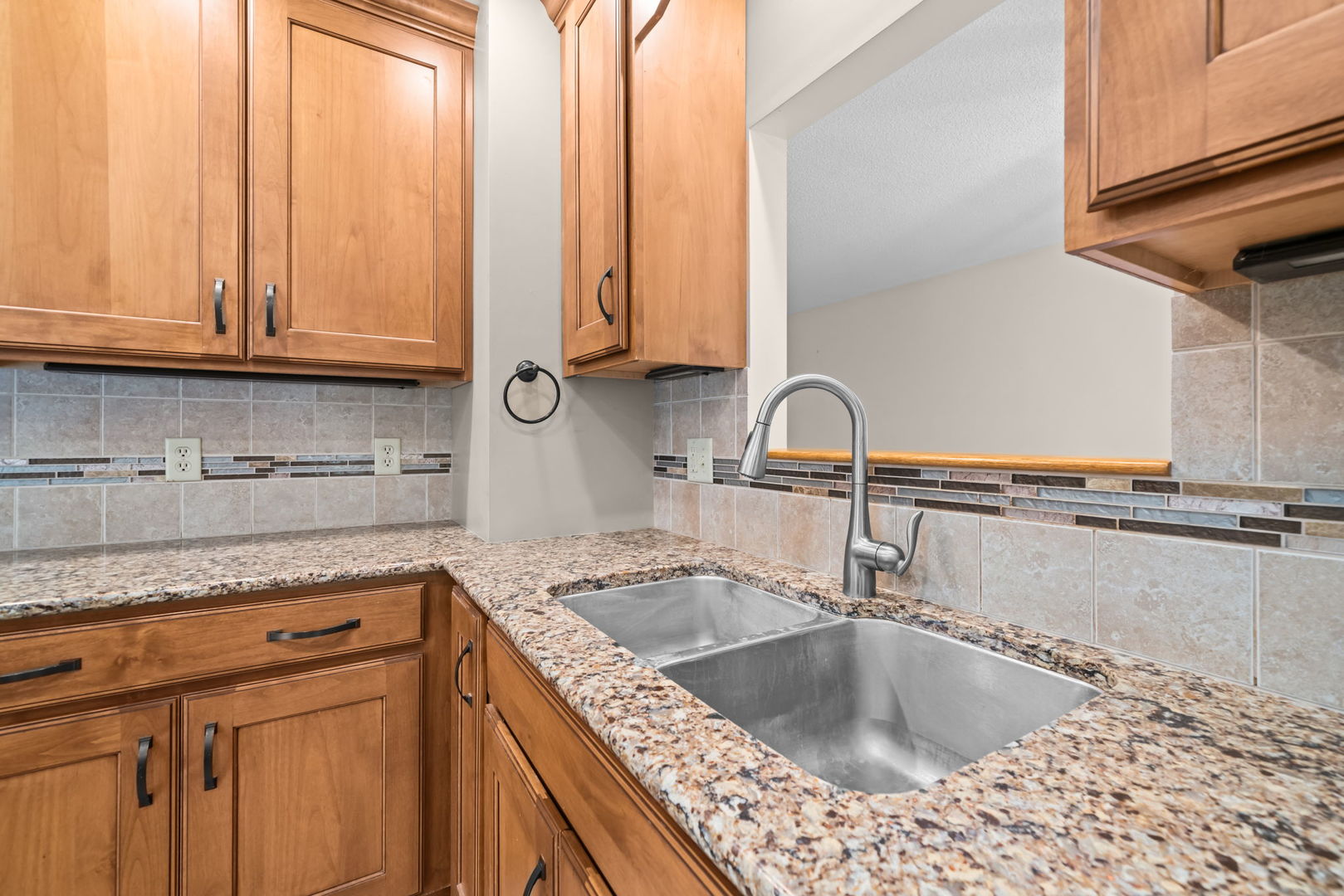 5748 South Skare Road Rochelle, IL 61068 - Photo 5 of 45 a kitchen with granite countertop a sink and a stove