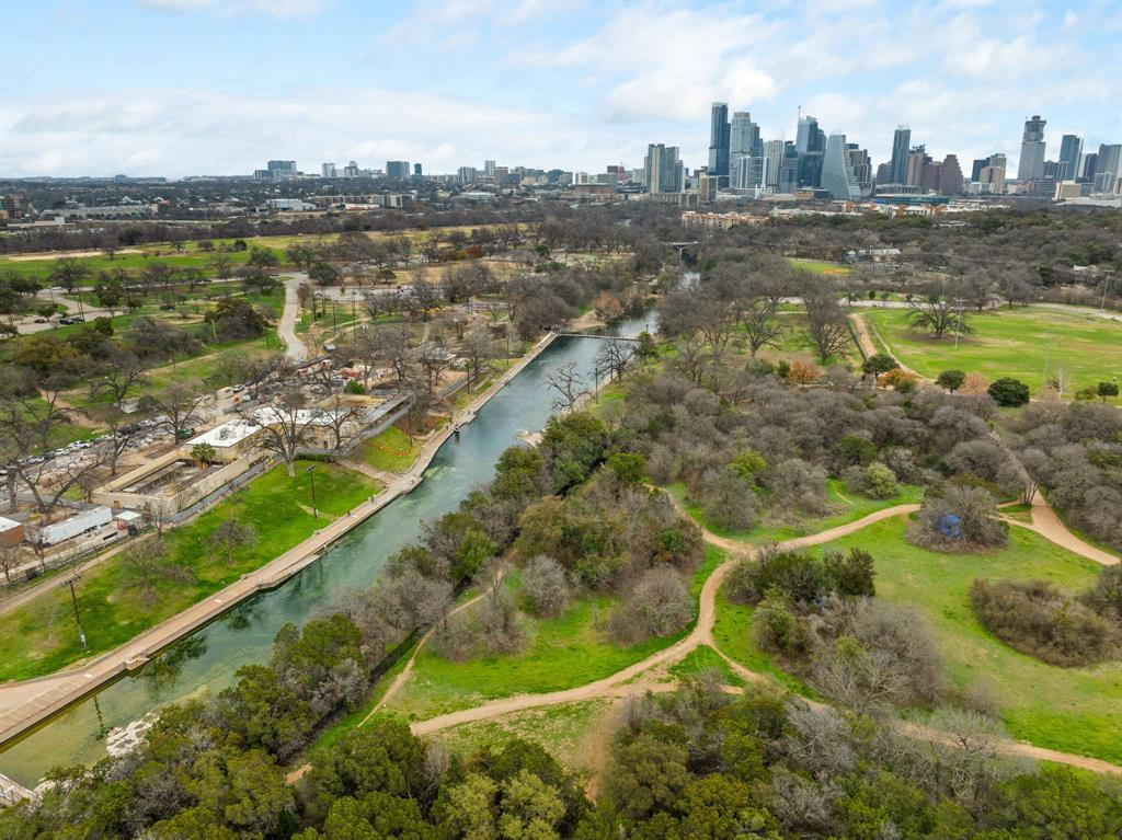 1900 Barton Springs Road, Unit 3013 Austin, TX 78704 - Photo 24 of 27 A vibrant cityscape frames this verdant park, showcasing abundant natural beauty and urban accessibility.