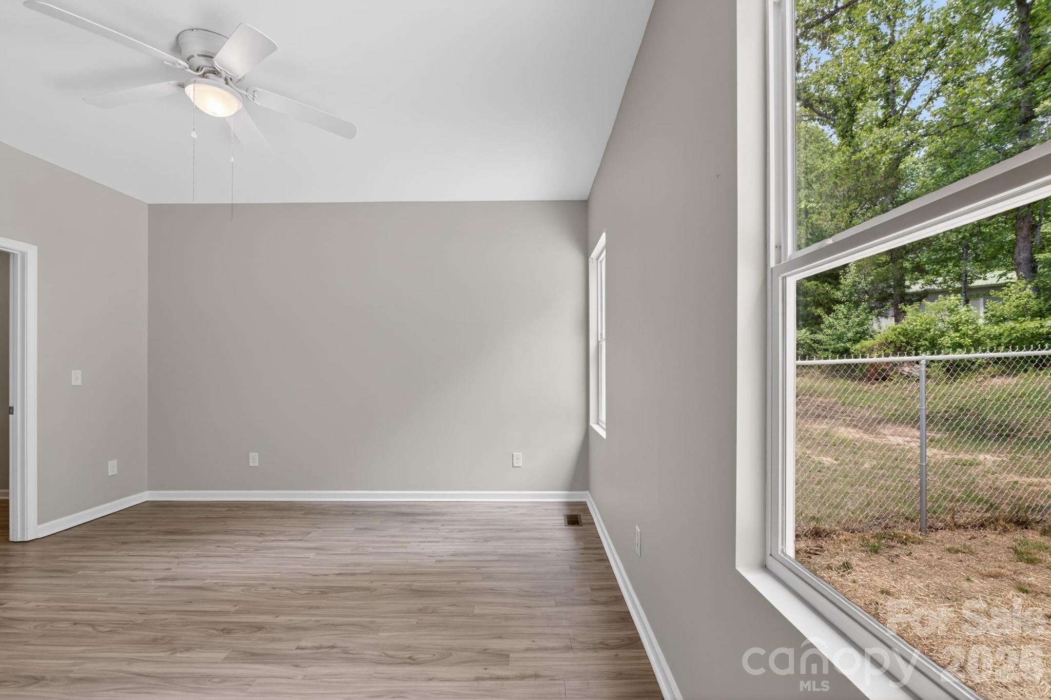 2119 South Road Morganton, NC 28655 - Photo 39 of 47 an empty room with wooden floor and windows