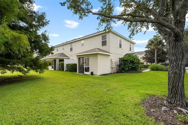 a view of a house with a yard