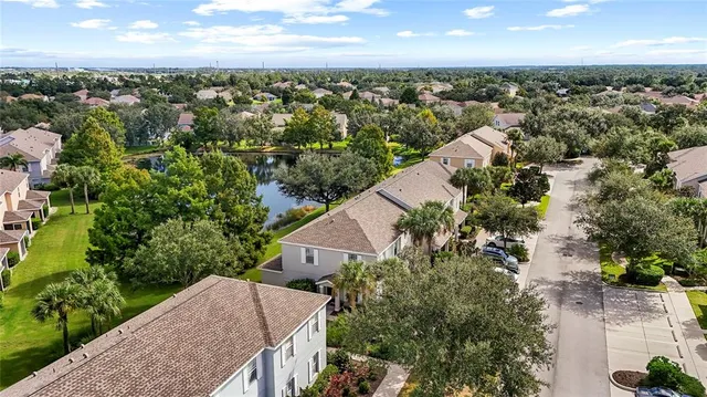 an aerial view of residential houses with outdoor space