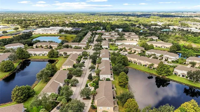 an aerial view of residential houses with outdoor space