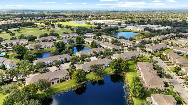 an aerial view of residential houses with outdoor space