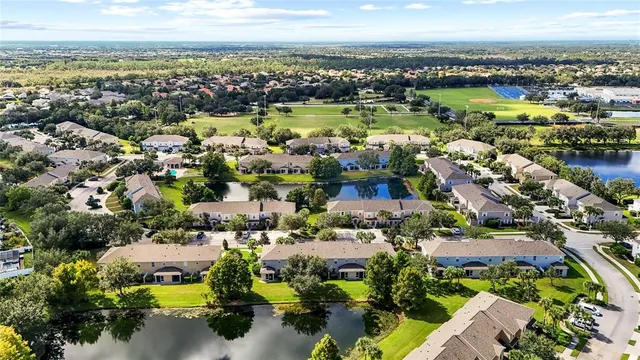 an aerial view of a house with a swimming pool