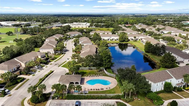 an aerial view of a house with a swimming pool