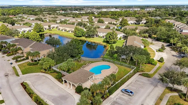 an aerial view of a house with a swimming pool