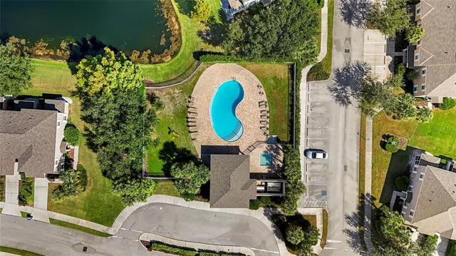 a dining room with furniture and a floor to ceiling window