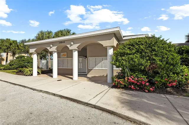 a view of a swimming pool and trees in the background