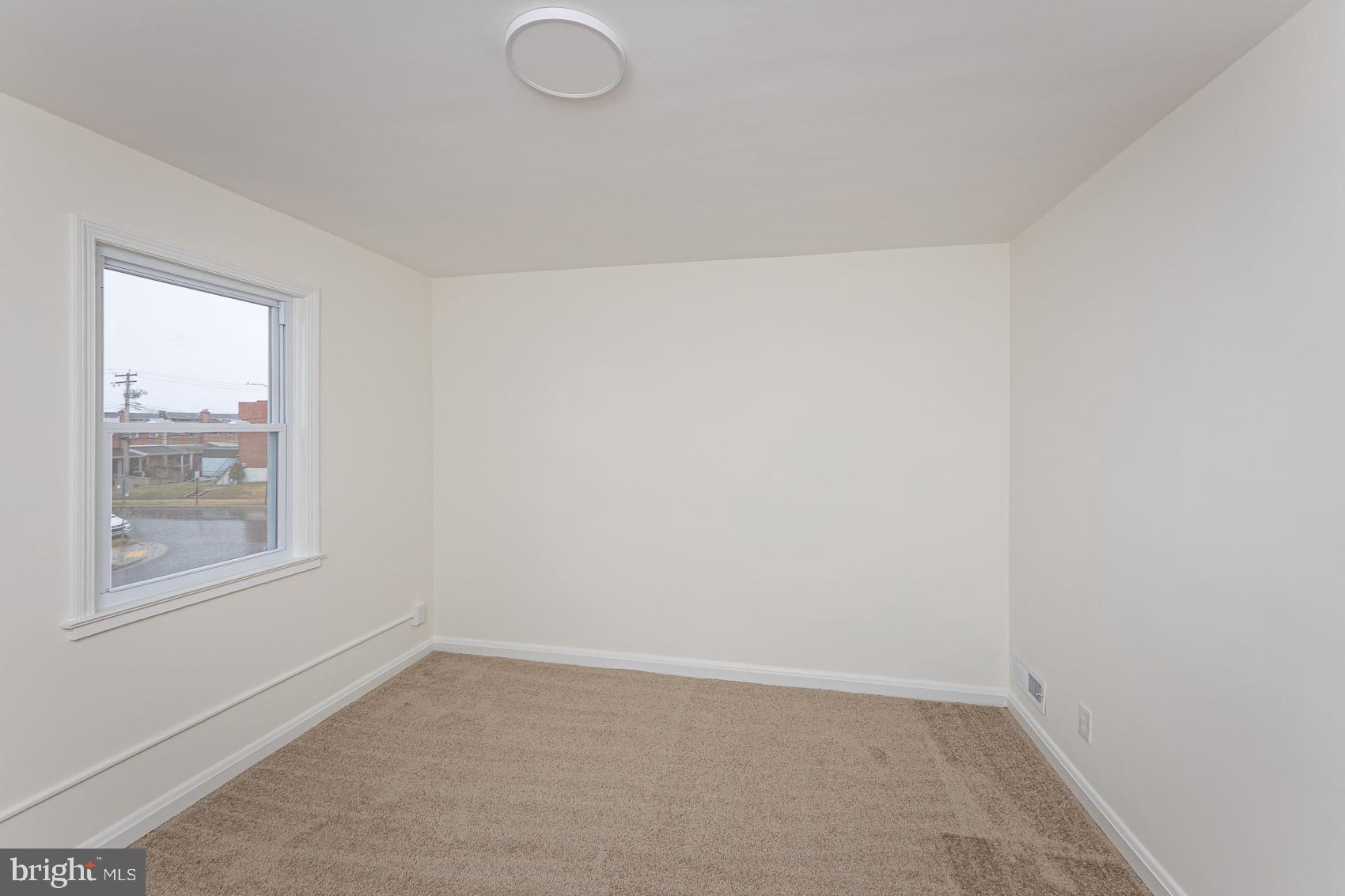 7035 Gough Street Baltimore, MD 21224 - Photo 14 of 25 an empty room with a window