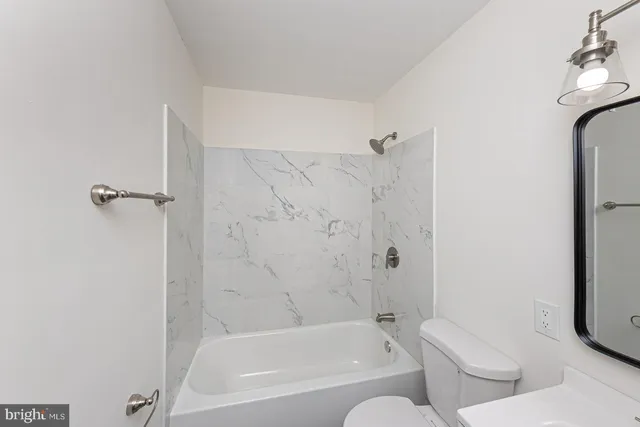 a bathroom with a bathtub and shower