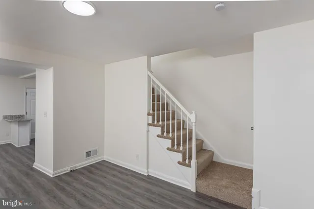 a view of entryway with wooden floor