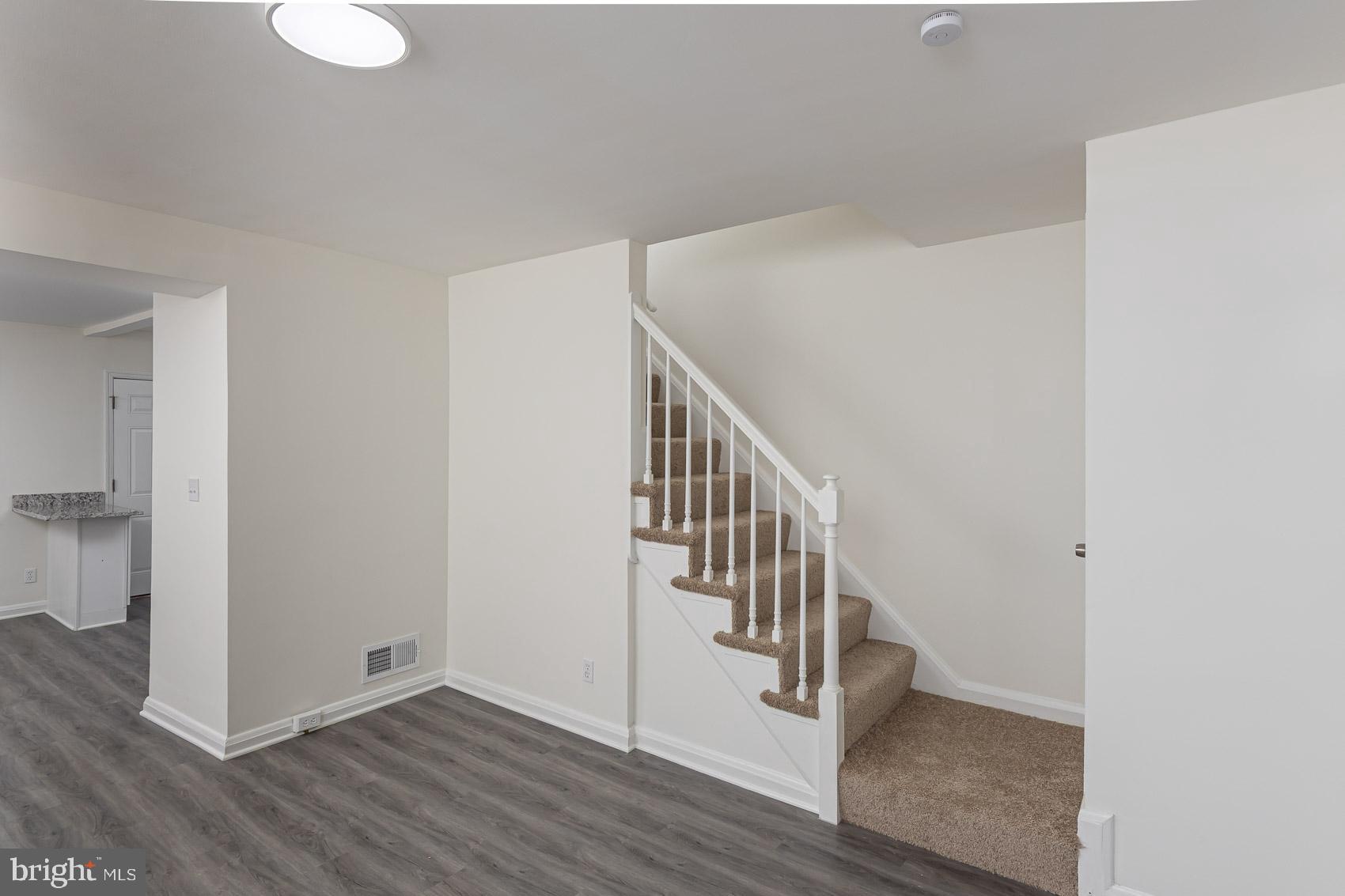 7035 Gough Street Baltimore, MD 21224 - Photo 10 of 25 a view of entryway with wooden floor