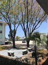 1150 East Sample Road, Unit 306 Pompano Beach, FL 33064 - Photo 7 of 9 a view of a yard with plants and trees