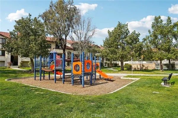 a view of park with bench and trees