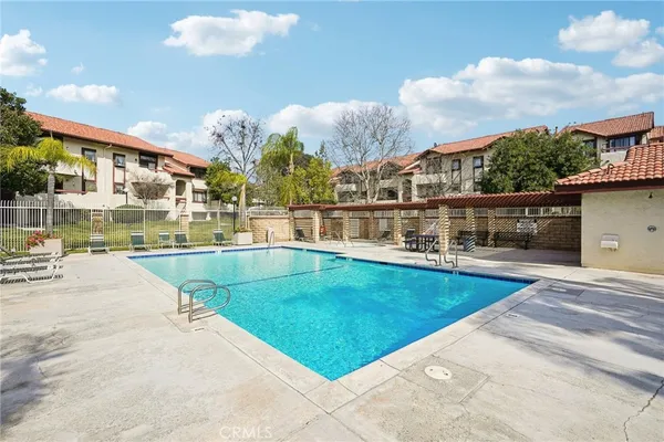 a view of a swimming pool with a patio
