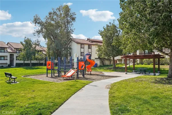 a view of a park with swings and slides