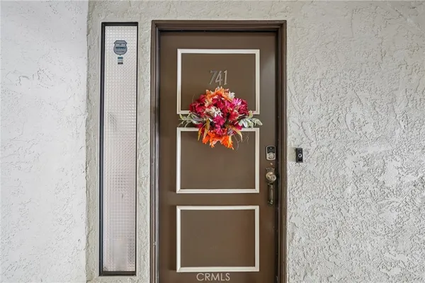a front view of a house with wooden door