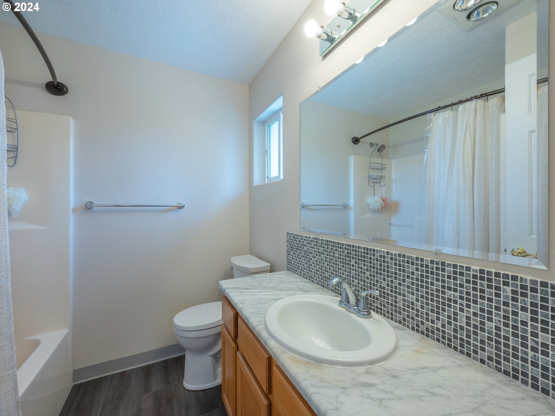 889 Aldridge Place Springfield, OR 97478 - Photo 18 of 46 a bathroom with a granite countertop sink toilet and a mirror