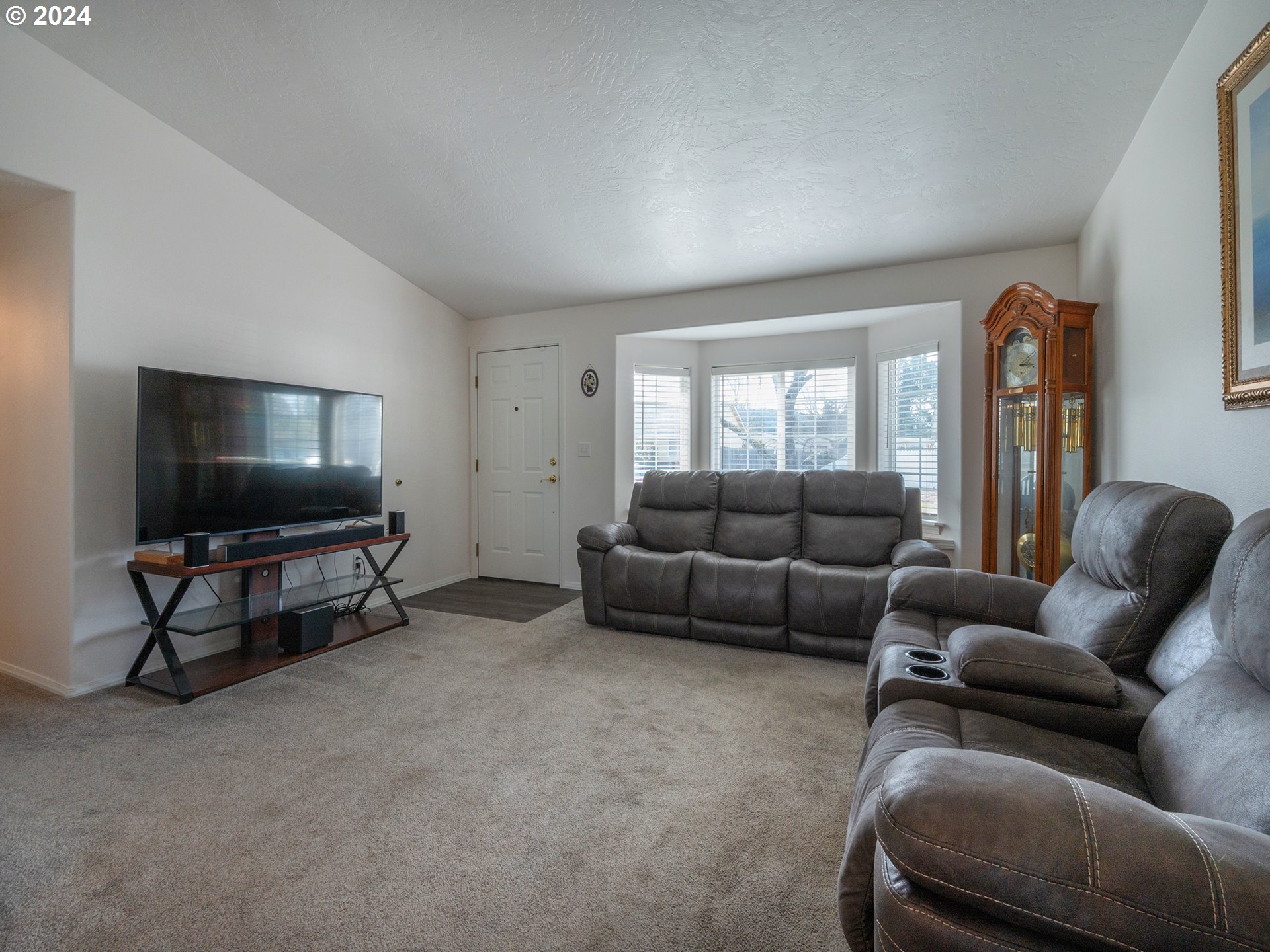 889 Aldridge Place Springfield, OR 97478 - Photo 5 of 46 a living room with furniture and a flat screen tv
