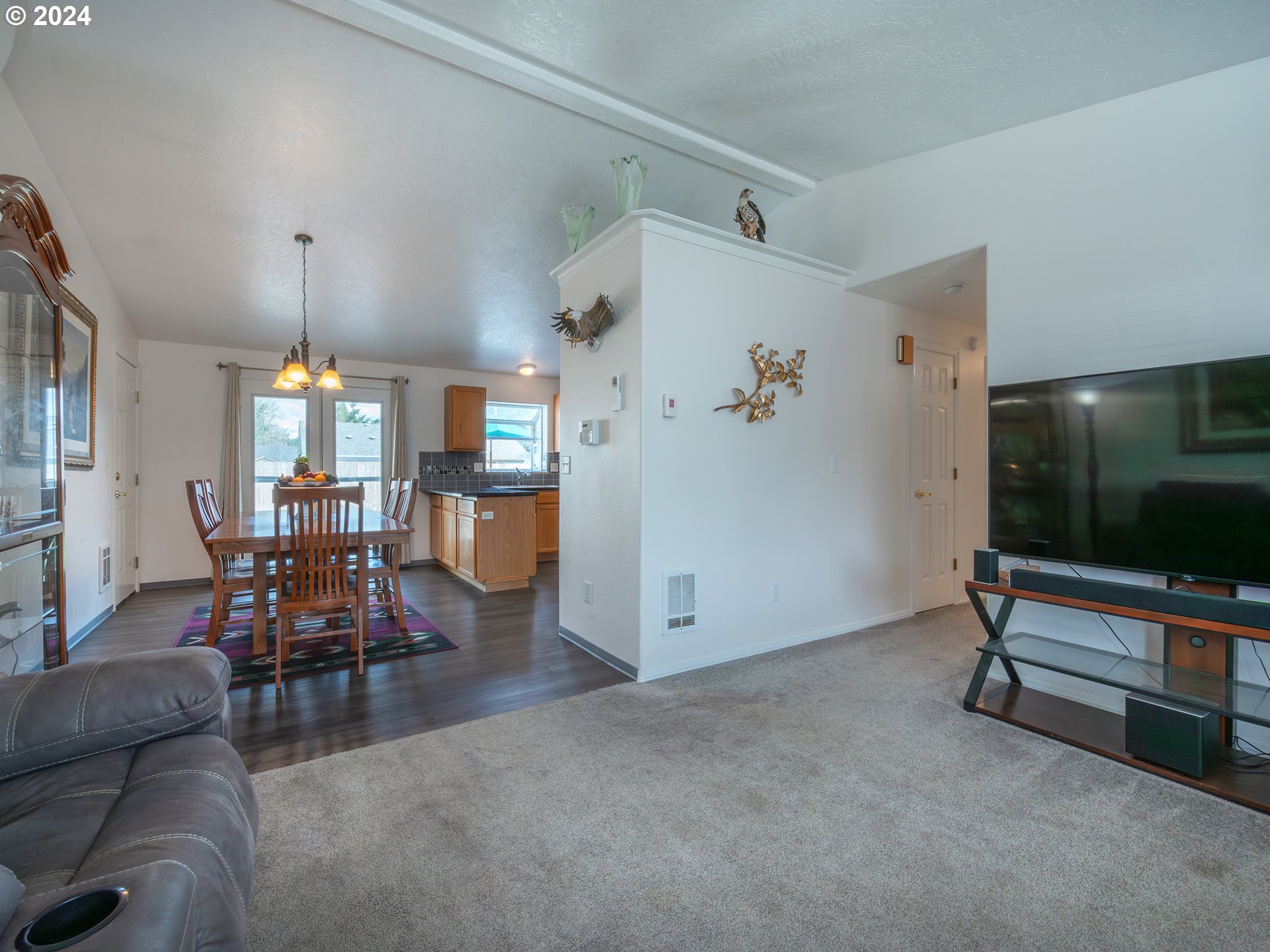 889 Aldridge Place Springfield, OR 97478 - Photo 6 of 46 a living room with furniture and a flat screen tv