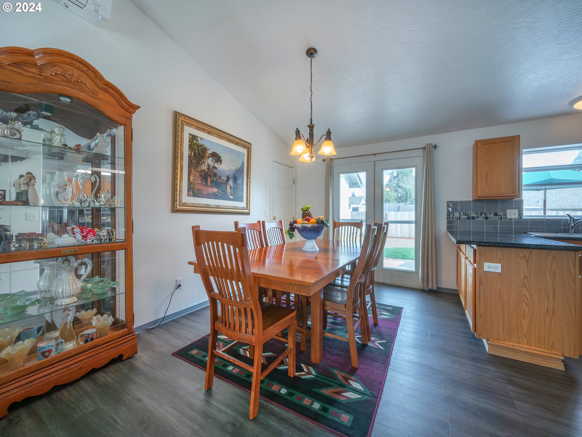 889 Aldridge Place Springfield, OR 97478 - Photo 7 of 46 a view of a dining room with furniture and wooden floor