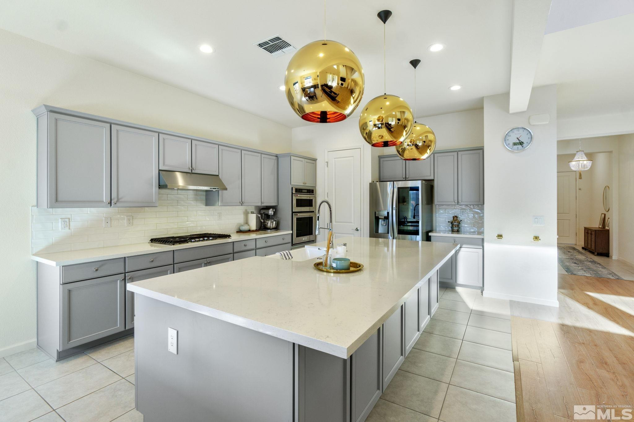 9401 Flying Horse Road Reno, NV 89521 - Photo 13 of 40 a kitchen with a cabinets and chandelier