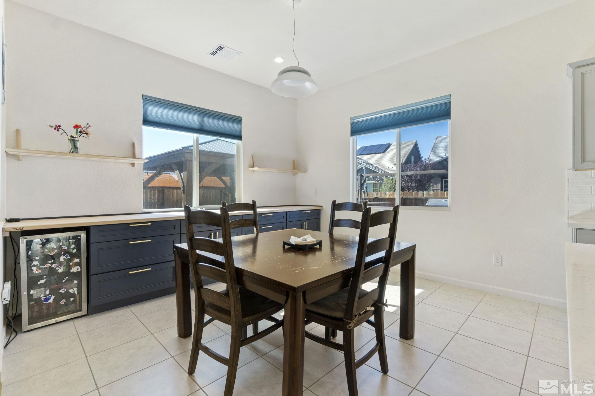 9401 Flying Horse Road Reno, NV 89521 - Photo 15 of 40 a dining room with a wooden table and chairs