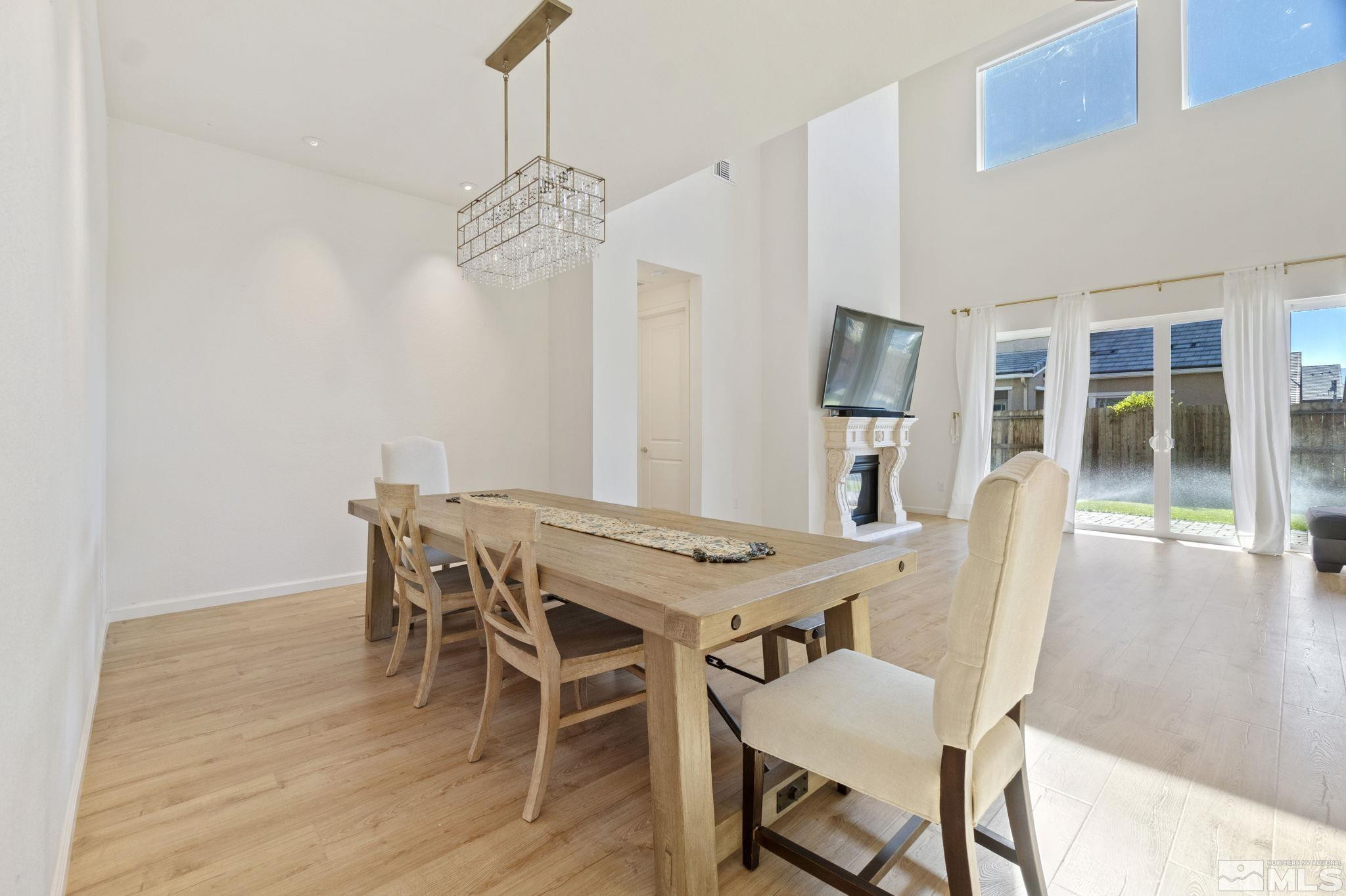 9401 Flying Horse Road Reno, NV 89521 - Photo 20 of 40 a view of a dining room with furniture and wooden floor