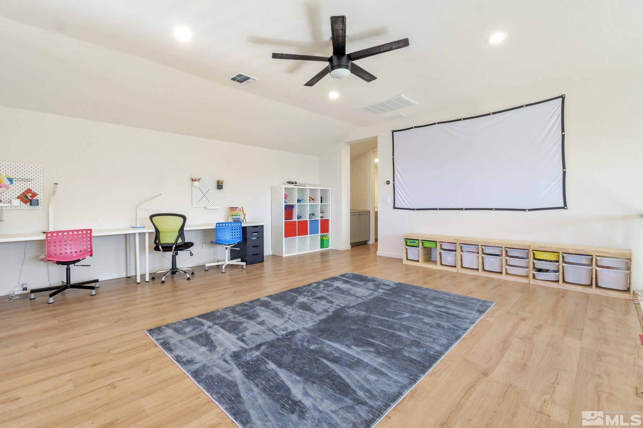 9401 Flying Horse Road Reno, NV 89521 - Photo 22 of 40 a living room with furniture and a flat screen tv
