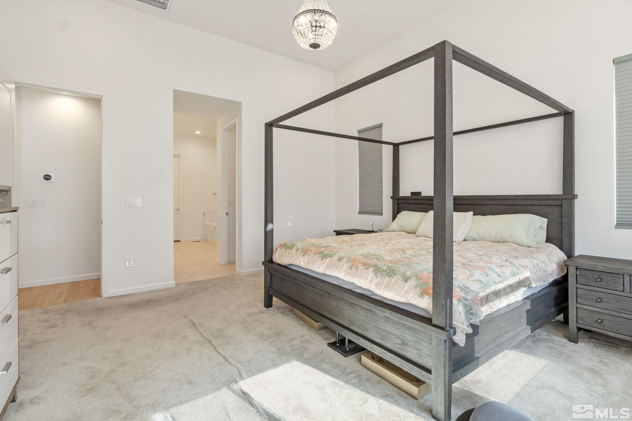 9401 Flying Horse Road Reno, NV 89521 - Photo 25 of 40 a bed sitting in a bedroom next to a window
