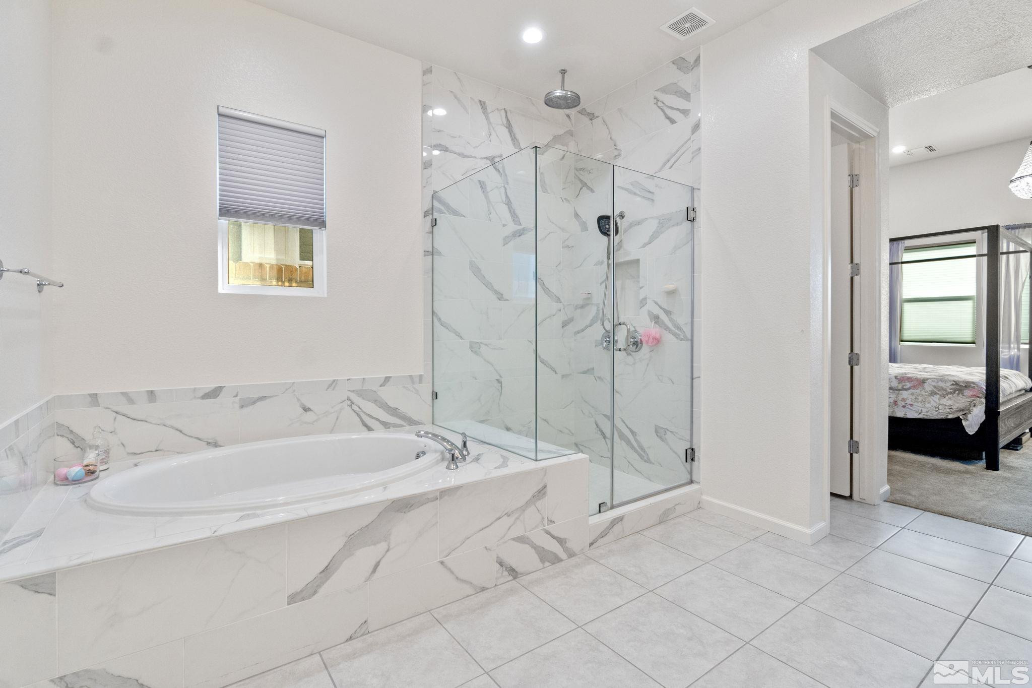 9401 Flying Horse Road Reno, NV 89521 - Photo 26 of 40 a spacious bathroom with a bathtub and shower