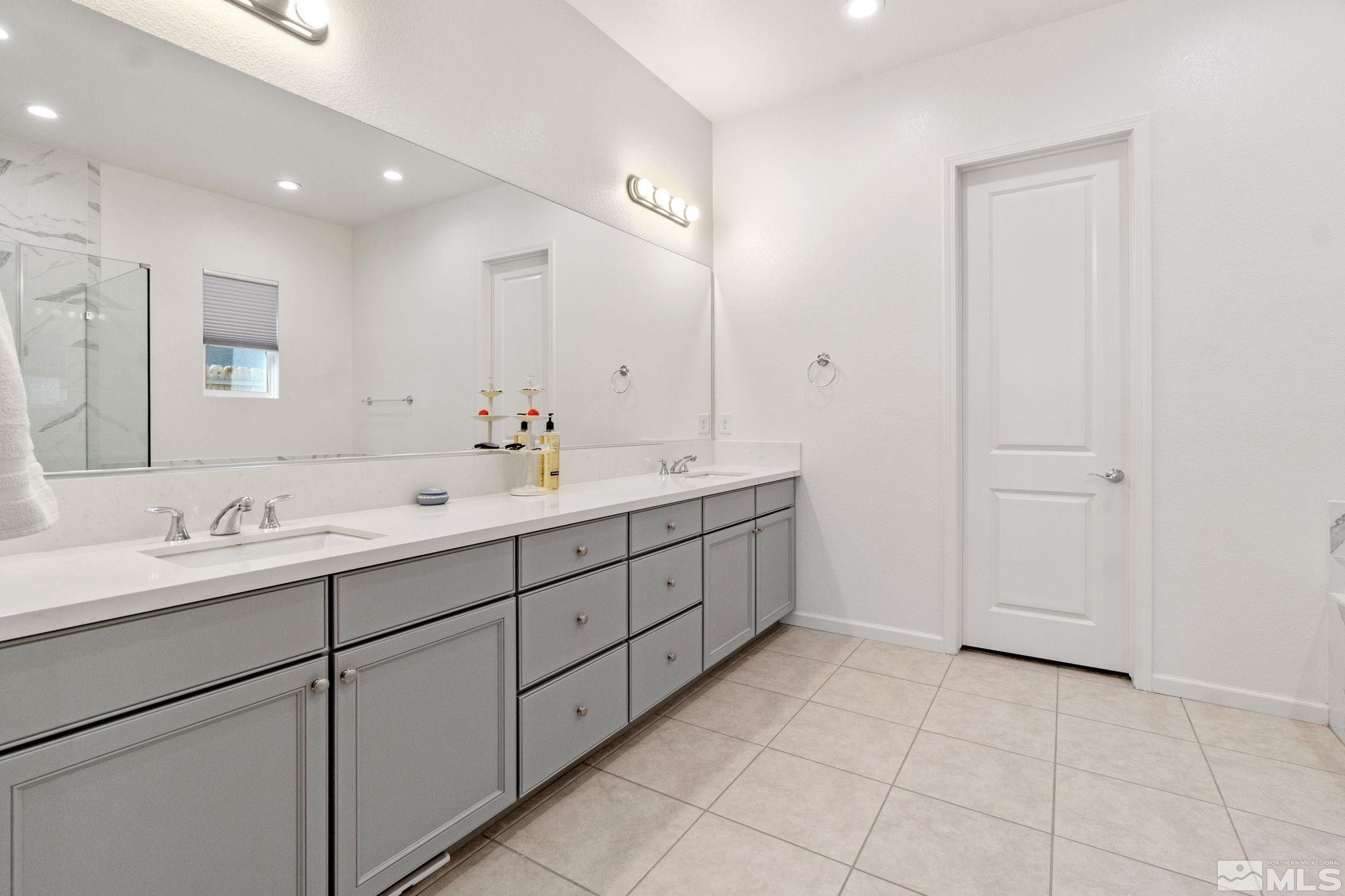 9401 Flying Horse Road Reno, NV 89521 - Photo 27 of 40 a spacious bathroom with a double vanity sink mirror and