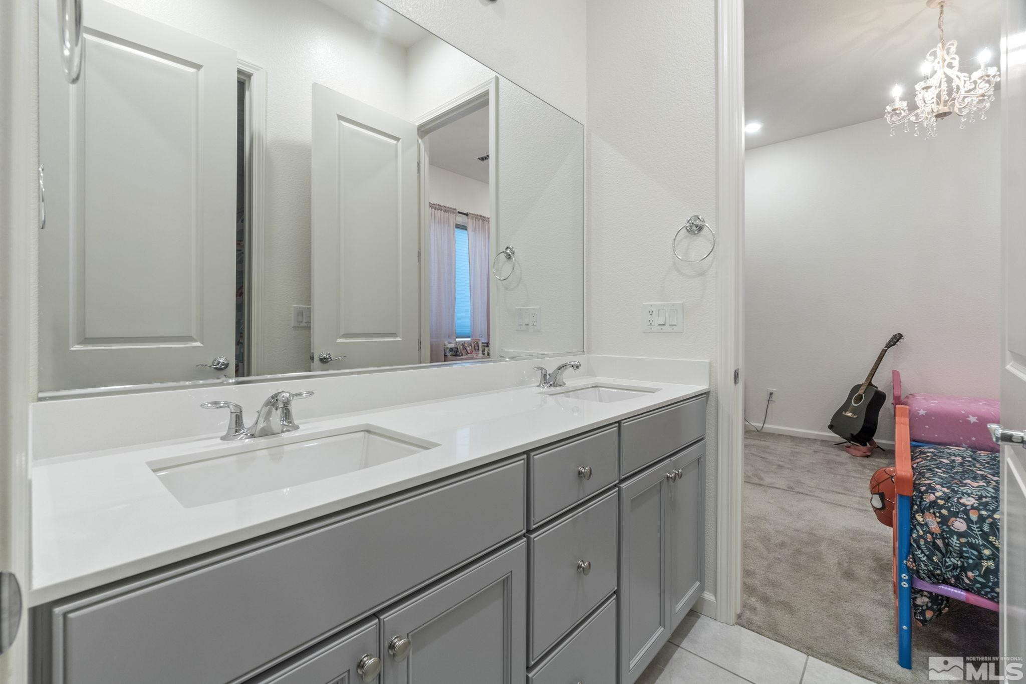9401 Flying Horse Road Reno, NV 89521 - Photo 30 of 40 a bathroom with a sink double vanity and a mirror