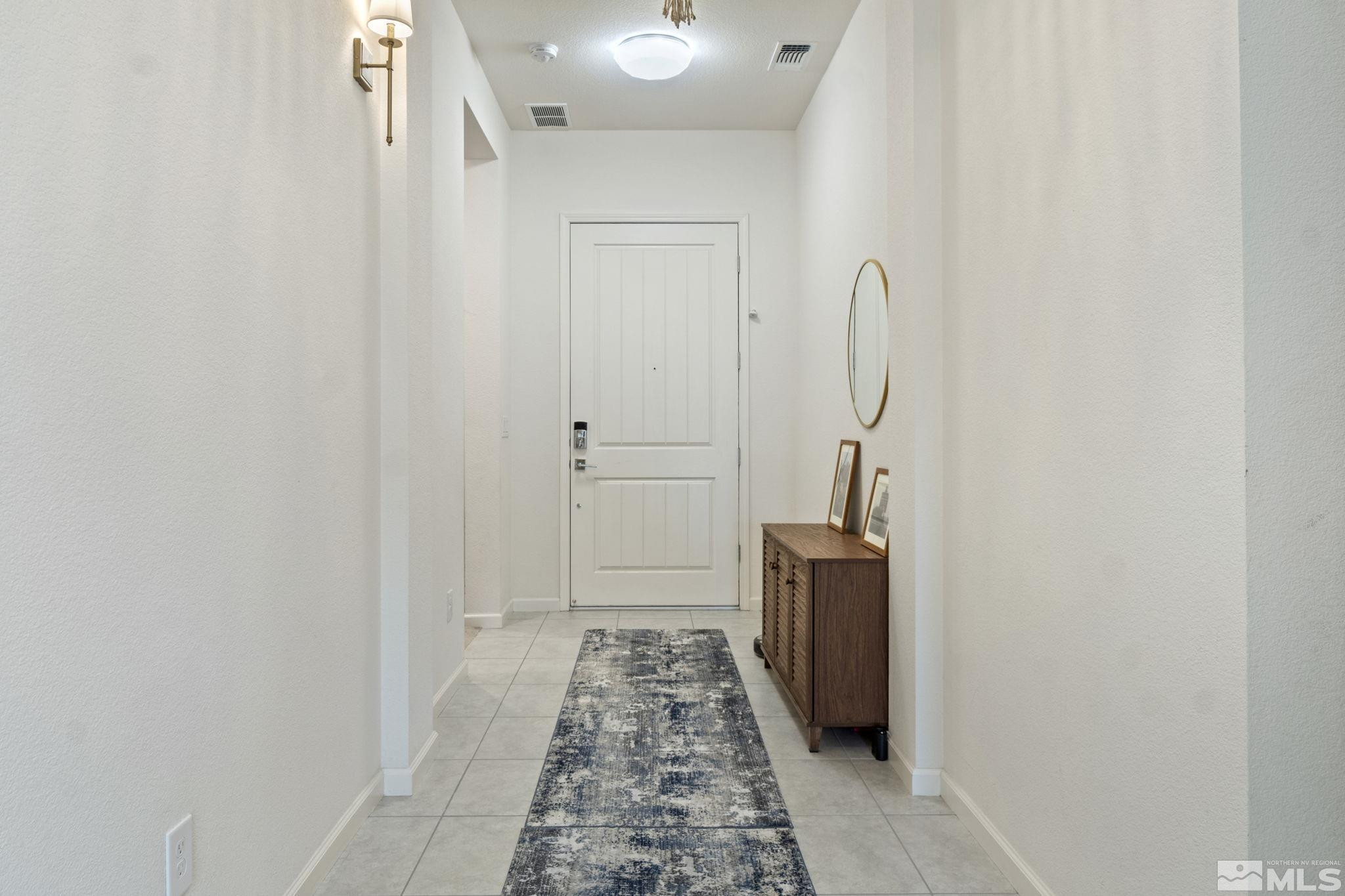 9401 Flying Horse Road Reno, NV 89521 - Photo 3 of 40 a view of hallway with wooden floor