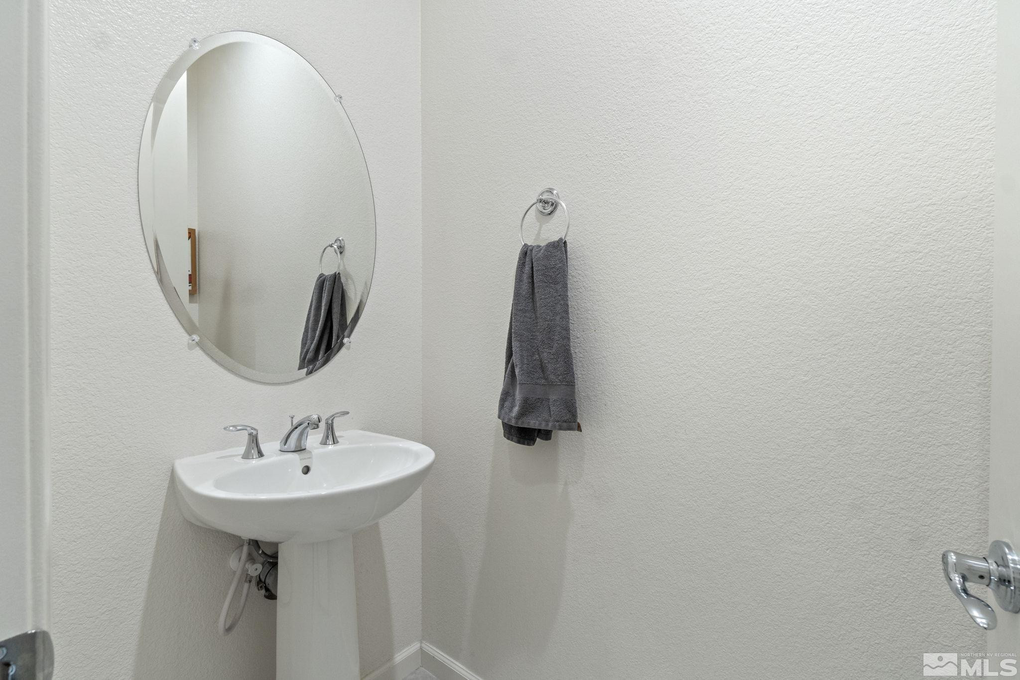 9401 Flying Horse Road Reno, NV 89521 - Photo 34 of 40 a bathroom with a sink and mirror