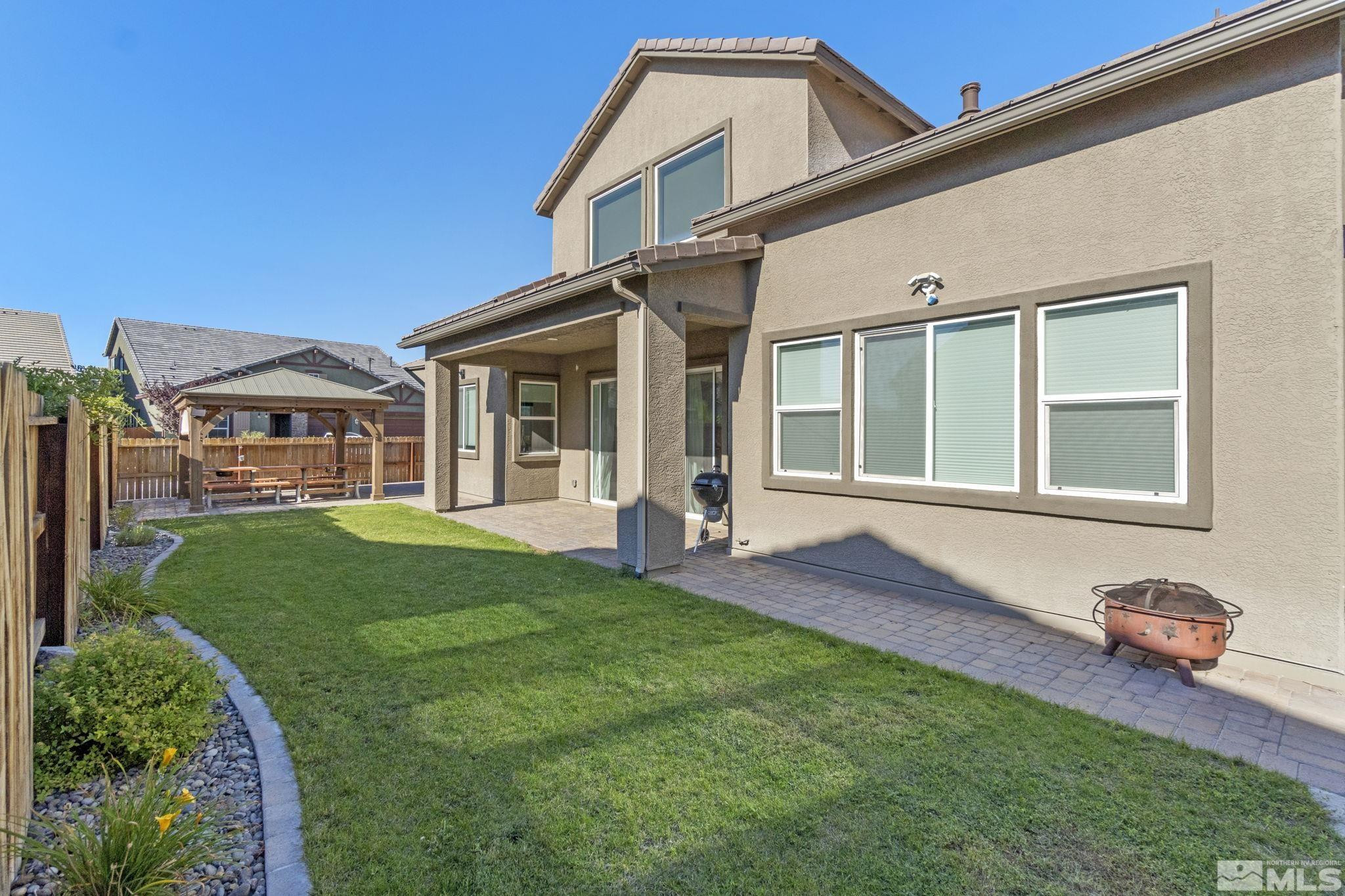 9401 Flying Horse Road Reno, NV 89521 - Photo 36 of 40 a front view of a house with a garden