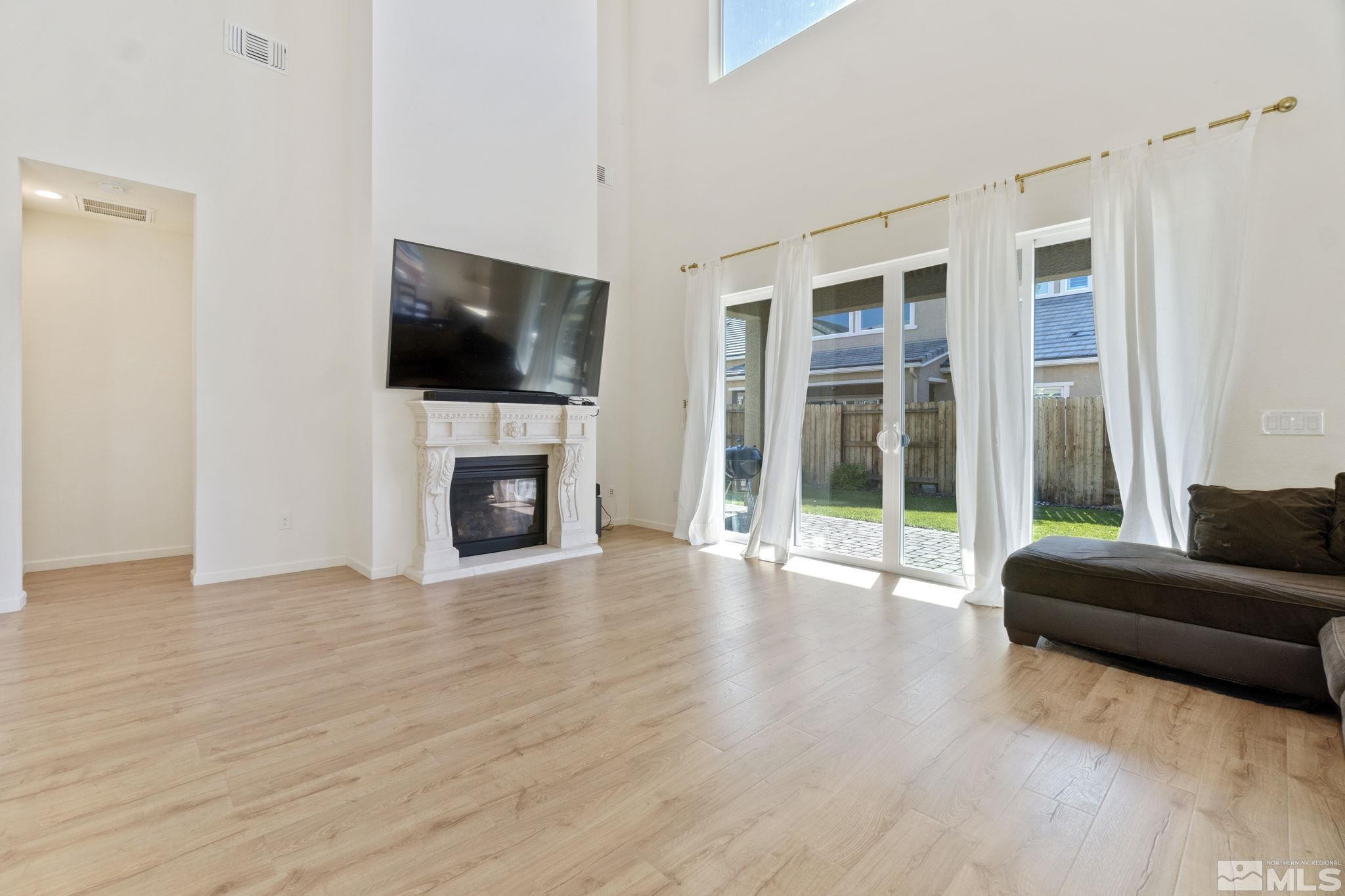 9401 Flying Horse Road Reno, NV 89521 - Photo 5 of 40 a view of a livingroom with furniture wooden floor and window