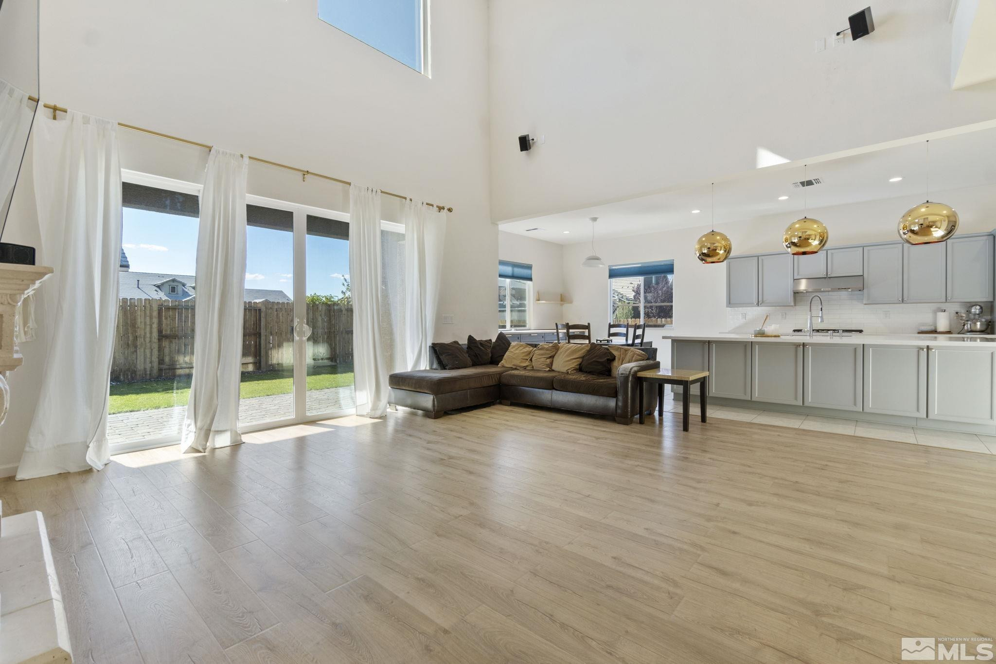 9401 Flying Horse Road Reno, NV 89521 - Photo 6 of 40 a living room with furniture and a large window