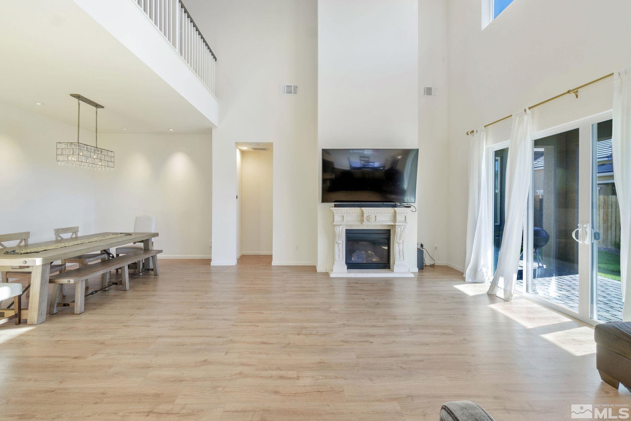 9401 Flying Horse Road Reno, NV 89521 - Photo 8 of 40 a view of a livingroom with furniture and a flat screen tv